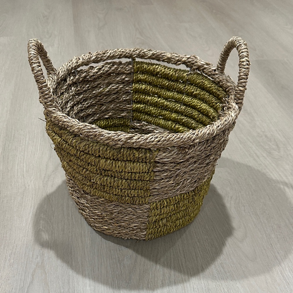 Green and tan wicker basket with handles